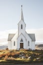 Exterior of little white country church building on a sunny day with white clouds Royalty Free Stock Photo