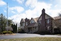 Exterior of a luxurious house with brown brick walls on sale in Overland Park, Kansas, US