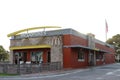 Exterior of a Mc Donald`s fast food restaurant.