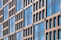 Exterior of modern architecture in the city center. Construction abstract background. Detail of the facade with windows Royalty Free Stock Photo