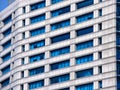 Exterior of A Modern Building with White Walls and Blue Glass Windows Royalty Free Stock Photo