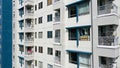 Exterior of a modern high-rise multi-story apartment building condo - facade, windows and balconies Royalty Free Stock Photo