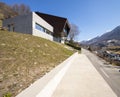 Exterior modern isolated villa, surrounded by nature. Iron and concrete cladding