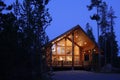 The exterior of a modern mountain log home. Royalty Free Stock Photo