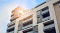 Exterior of a modern multi-story apartment building - facade, windows and balconies. Royalty Free Stock Photo