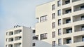 Exterior of a modern multi-story apartment building - facade, windows and balconies. Royalty Free Stock Photo