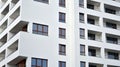 Exterior of a modern multi-story apartment building - facade, windows and balconies. Royalty Free Stock Photo