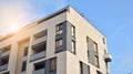 Exterior of a modern multi-story apartment building - facade, windows and balconies. Royalty Free Stock Photo