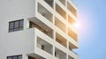 Exterior of a modern multi-story apartment building - facade, windows and balconies. Royalty Free Stock Photo