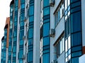 Exterior of a modern multi-story apartment building. Facade, windows and balconies Royalty Free Stock Photo