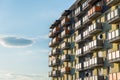 Exterior of modern residential apartment building with balconies on housing estate. Urban landscape with block of flats. Royalty Free Stock Photo