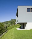 Exterior modern style villa. Modern house located in Switzerland, side view. In front of a beautiful green lawn. Detail with dry a
