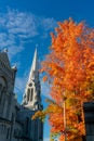 Exterior view of the Basilica of Sainte-Anne-de-Beaupre church with red maple tree Royalty Free Stock Photo