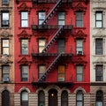 Exterior of New York City apartment building with fire escapes