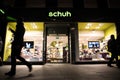 Exterior Night Shot of Illuminated entrance to Schuh Footware store