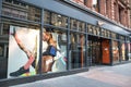 Exterior of Nike sports clothing shop showing window display, entrance, logo and branding Royalty Free Stock Photo