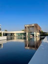Exterior of the Oberoi Beach Luxury Resort with water features and contemporary architecture in Al Zorah, Ajman, UAE.