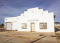 Exterior Of Old Abandoned Garage With Boarded Up Windows