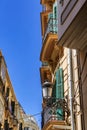 Exterior of an old house with a lantern and a balcony Royalty Free Stock Photo