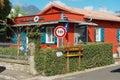 Exterior of the old red wooden post office building in Fond de Rond Point in Saint-Denis De La Reunion, France.