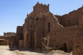 Exterior of an old ruined adobe building with tower in Agdz, Morocco Royalty Free Stock Photo