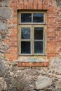 Exterior of an old stone and brick house with vintage window frame Royalty Free Stock Photo
