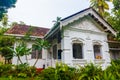 Exterior of an old Villa hotel with white walls in tropical garden, Asia, Sri Lanka Royalty Free Stock Photo