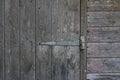 Exterior of old weathered wooden shed showing door and hinge detail Royalty Free Stock Photo