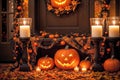 exterior of the old wooden house is decorated with harvest of pumpkins and leaves for halloween holiday, door and window Royalty Free Stock Photo