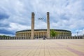 Exterior panoramic view of the Berlin Olympic Stadium with a beautiful sky, as background of a postcard with free space for text