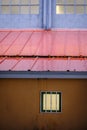 Exterior part of a sports hall, with a metal roof