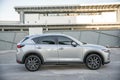 Exterior passengers side view of a Mazda CX 5 sport utility vehicle
