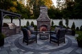 Exterior patio with fireplace and furniture. AI generated. Large courtyard with a stone grill area Royalty Free Stock Photo