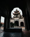 Exterior of Phat Diem Cathedral in Northern Vietnam with spires, cross, doorways, and lanterns Royalty Free Stock Photo