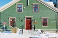 Exterior of the Polar museum building with the Polar explorer Roald Amundsen bust in front of it in Tromso, Norway.