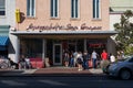 The Exterior of Leopold`s Ice Cream with a Line of People in the Historic District of Savannah Georgia