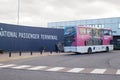 Exterior of Port of Tyne International Passenger Terminal building showing sign and passenger transport bus