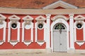 Exterior of the red painted stables building next to Rundale palace in Pilsrundale, Latvia. Royalty Free Stock Photo