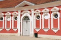 Exterior of the red painted stables building windows next to Rundale palace in Pilsrundale, Latvia. Royalty Free Stock Photo