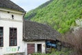 Exterior of the ruins of an old village abandoned house with a ruined tiled roof Royalty Free Stock Photo