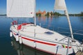 Exterior of the sailboat tied at the Galve lake with Trakai castle at the background in Trakai, Lithuania.