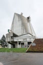 Exterior of the Saint-Pierre Catholic church in Firminy, France under light sky