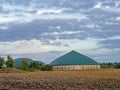 Exterior shot of an agricultural biogas plant in a harvested corn field in Lower Saxony, Germany