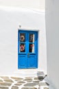 Exterior shot of a blue door, typical of a house on the island of Myconos, Cyclades, Greece Royalty Free Stock Photo