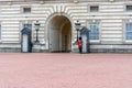 Exterior shot of the Buckingham Palace, Royal residence in London, England with police guards