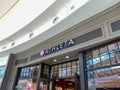 The exterior sign of the Athleta retail store at Millenia Mall in Orlando, Florida