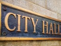 Exterior sign that reads `City Hall ` in brass lettering. Close up Royalty Free Stock Photo