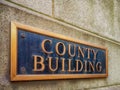 Exterior sign that reads `County Building` in brass lettering Royalty Free Stock Photo