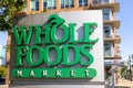 Exterior sign of the Whole foods market is an American multinational supermarket chain Royalty Free Stock Photo