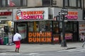 Exterior signs on one of Dunkin Donuts